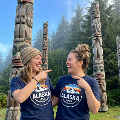Lifestyle View — Alaska 1959 Retro Mountain Sunset Badge Shirt Vintage Statehood Tee — T-Shirt